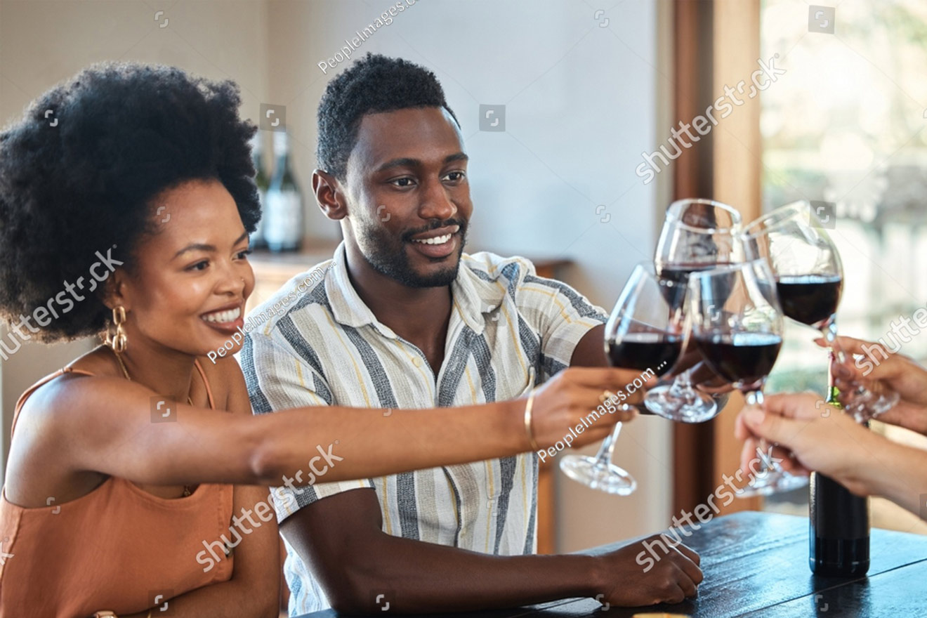 couple enjoying a toast with others